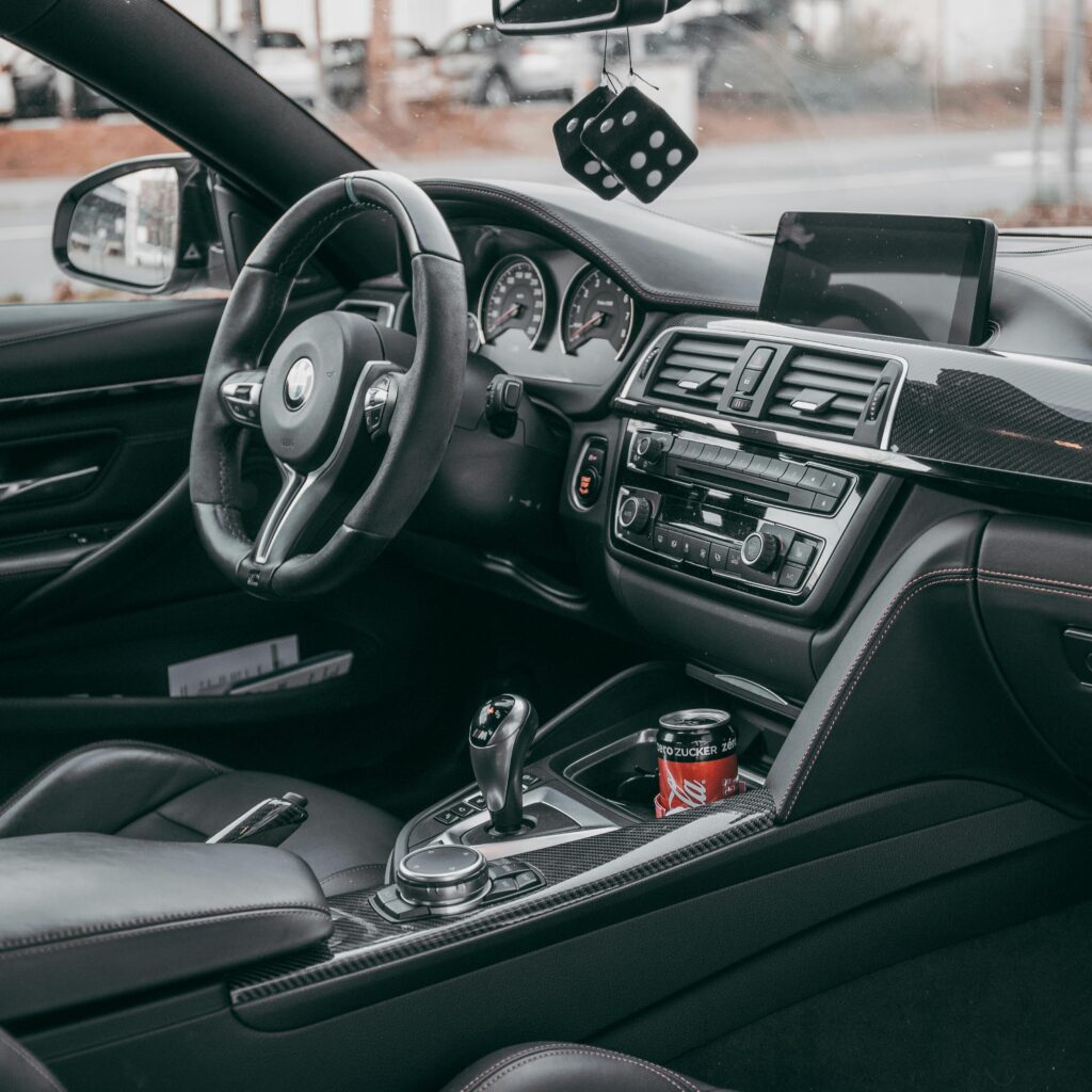 Close-up of a sleek and modern car interior showcasing elegant design elements and technology.