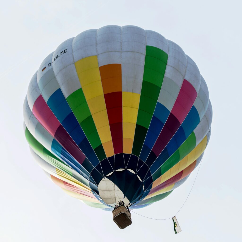 Vibrant hot air balloon soaring in the sky, capturing the essence of freedom and adventure.